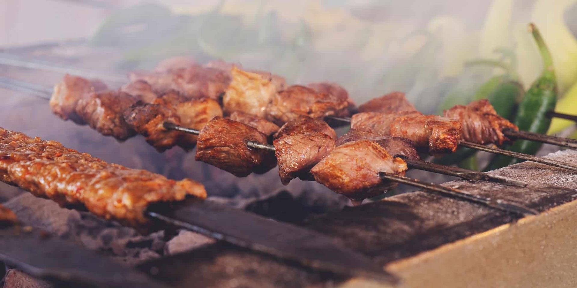 Kebab on a scewer on the grill.