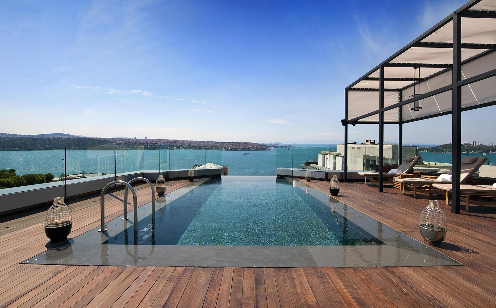 Infinity pool on the wooden decked terrace at Swissotel The Bosphorus, overlooking the blue Bosphorus and the Asian shore